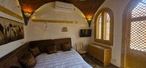 a bedroom with a large bed in a room at Guesthouse Nut in Luxor +66 photos