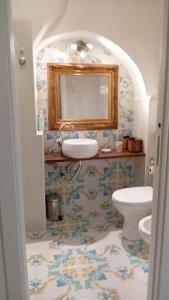 a bathroom with a sink and a toilet at Dimora San Pietro a Corte in Salerno +11 photos