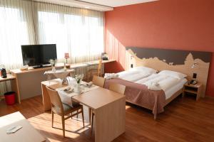 Voodi või voodid majutusasutuse SwissEver Hotel Zug toas