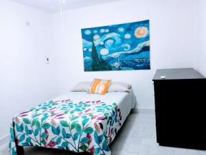 Giường trong phòng chung tại Departamento BLUE