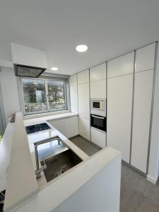 Kuchyň nebo kuchyňský kout v ubytování Casa Corrubedo