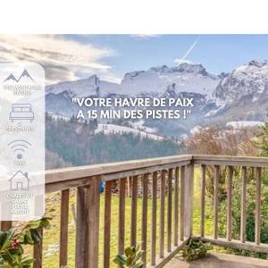 a sign on a deck with a view of a mountain at Le Mazot du Genévrier - Au coeur des Aravis in Les Clefs