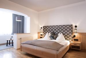 Postel nebo postele na pokoji v ubytování Landhotel Zellerhof