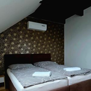 Postel nebo postele na pokoji v ubytování Apartmány pod Pálavou + 37 fotografií