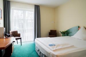 Postel nebo postele na pokoji v ubytování Trip Inn Hotel Dasing-Augsburg