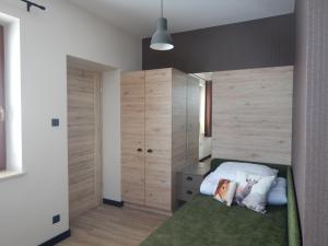 Ένα ή περισσότερα κρεβάτια σε δωμάτιο στο ApartamentyPodZakopanem.PL