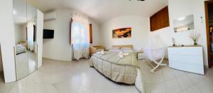 a living room with a large bed in a room at La casa dar braschi in Il Prato