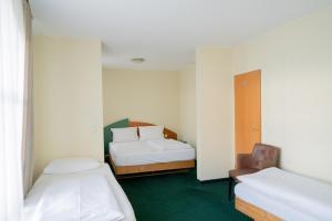 Postel nebo postele na pokoji v ubytování Trip Inn Hotel Dasing-Augsburg