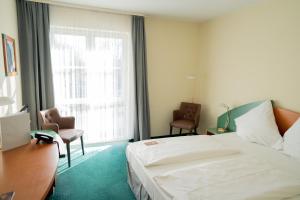 Postel nebo postele na pokoji v ubytování Trip Inn Hotel Dasing-Augsburg