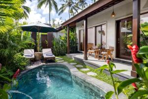 a pool in the backyard of a villa at Arvanya Villa Ubud in Tegalalang