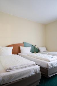 Postel nebo postele na pokoji v ubytování Trip Inn Hotel Dasing-Augsburg