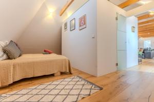 Łóżko lub łóżka w pokoju w obiekcie Loft Dachsberg