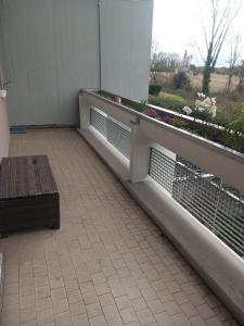 a balcony with a bench next to a window at PESCHIERA B Frazione San Bovio San Felicino in Linate
