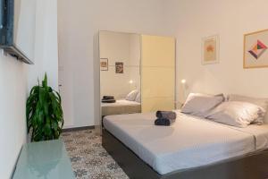 a bedroom with a bed and a large mirror at Aime's House in Sliema +64 photos