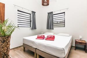 Łóżko lub łóżka w pokoju w obiekcie ABC Lodges Curacao