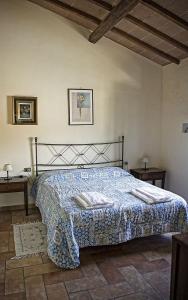 Кровать или кровати в номере Podere Il Gioiello