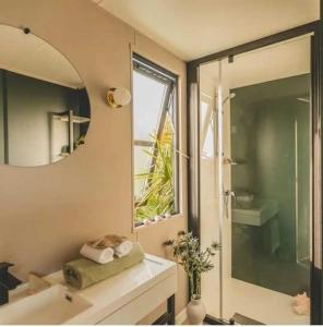 a bathroom with a sink and a mirror at Camping 4 étoiles - Piscine - ccbabhc in Aramits