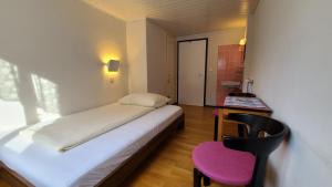 Postel nebo postele na pokoji v ubytování Hotel Cafe Seeblick