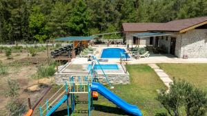 an aerial view of a playground with a slide and a pool at Sora No Mori Village in Marmaris +14 photos