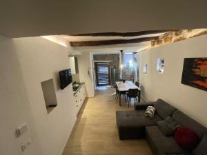 a living room with a couch and a table at La casetta di Giogi in Sutri