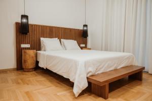 Postel nebo postele na pokoji v ubytování iKu Urban Apartment