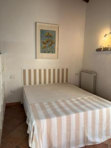 Posteľ alebo postele v izbe v ubytovaní Casa "Ale" con piscina comune e bellissimo giardino a 5 minuti dal mare