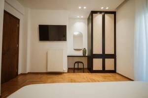 Postel nebo postele na pokoji v ubytování iKu Urban Apartment