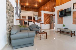 TV a/nebo společenská místnost v ubytování Hotel Ribera La Paz