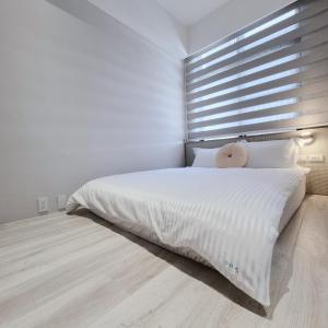 Una cama o camas en una habitación de 小蒔光民宿