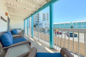 a balcony with chairs and a view of a parking lot at Sundial Unit D1 in Gulf Shores