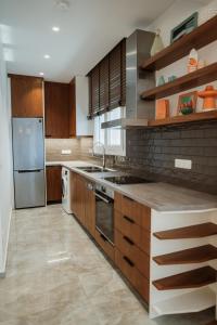 Kuchyň nebo kuchyňský kout v ubytování iKu Urban Apartment