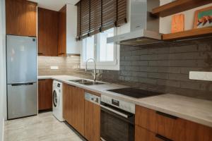 Kuchyň nebo kuchyňský kout v ubytování iKu Urban Apartment