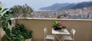 a table and chairs on a balcony with a view at Costa&Cielo in Salerno