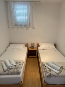 Postel nebo postele na pokoji v ubytování Apartment Pirun