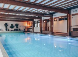 a large swimming pool in a building at Kiljava Hotel & Resort in Kiljava