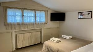 Posteľ alebo postele v izbe v ubytovaní Appartamenti Villa Renata