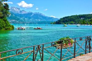 a view of a body of water with boats on it at Annecy calme proche centre parking gratuit in Annecy