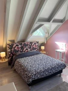 a bedroom with a large bed in a attic at Au Petit Bonheur in Thannenkirch +31 photos
