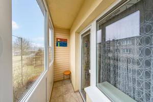 a window in a room with a view of a yard at Svencelės butas in Svencelė