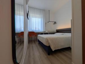 Postel nebo postele na pokoji v ubytování Hotel Piccolo