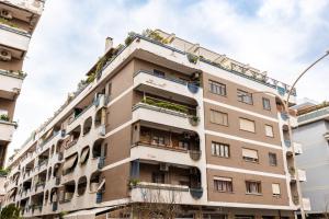 an apartment building with plants on the balconies at Il Vascello by ACS HOLIDAYS in Lido di Ostia