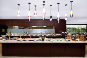 a buffet in a restaurant with many plates of food at Renaissance Caracas La Castellana Hotel in Caracas