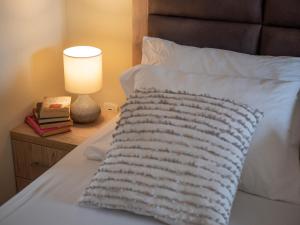 Ένα ή περισσότερα κρεβάτια σε δωμάτιο στο Palma Rooms & Suites Budva