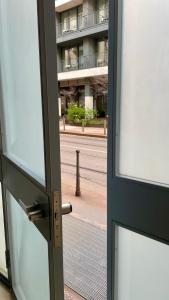 a glass door with a view of a building at BeCO Moscova District Loft in Milan