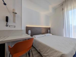 Postel nebo postele na pokoji v ubytování Hotel Piccolo