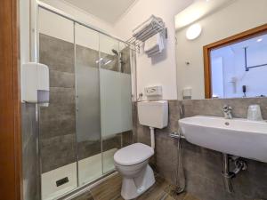 Koupelna v ubytování Hotel Piccolo