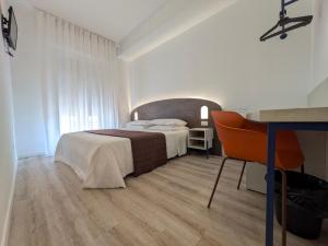 Postel nebo postele na pokoji v ubytování Hotel Piccolo