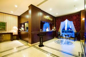 a hotel lobby with a bar and a salon at Latanya Palm & SPA Hotel Antalya in Antalya