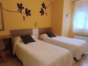 Postel nebo postele na pokoji v ubytování Apartamentos Querol