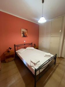 Postel nebo postele na pokoji v ubytování Theoxenia Paralio Astros